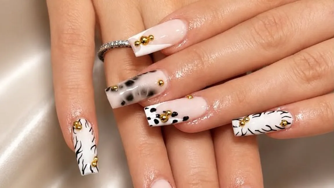Long square nail set with black and white animal print art and gold studs