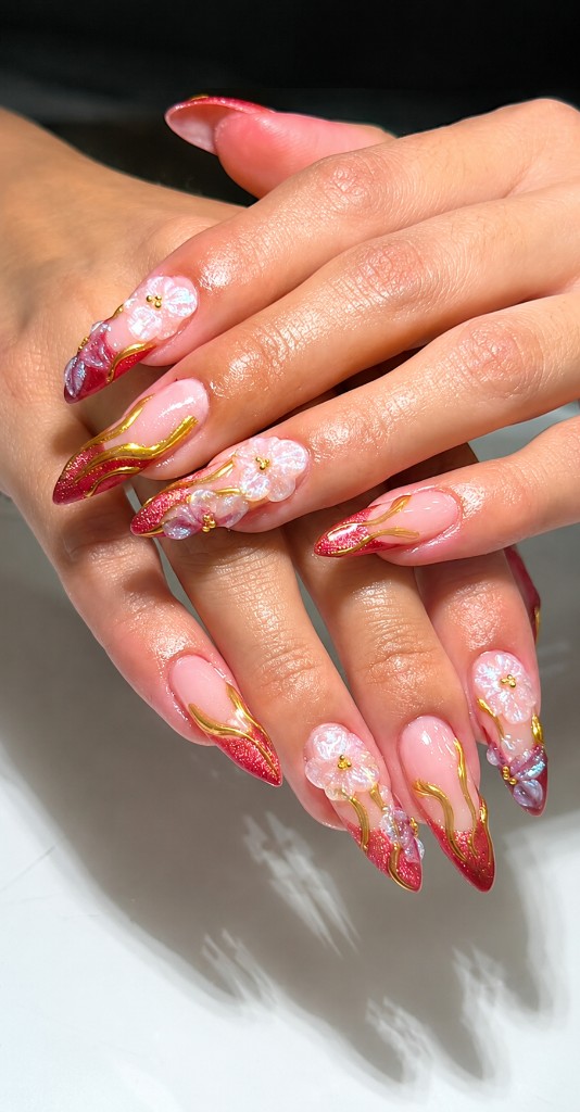 Pink floral gel nails with gold lines and red tips at Neo Nails Brickell